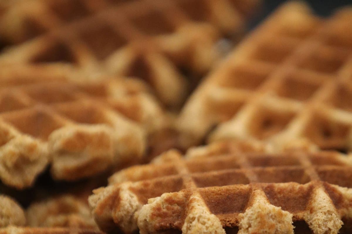 A stack of crisp, deep golden homemade waffles