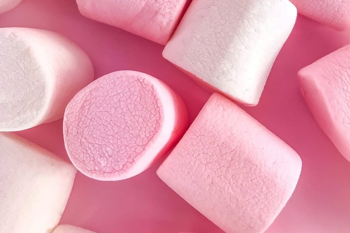 Plump pink and white homemade marshmallows piled together